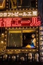 Neon-lit Shinjuku Street Scene at Night