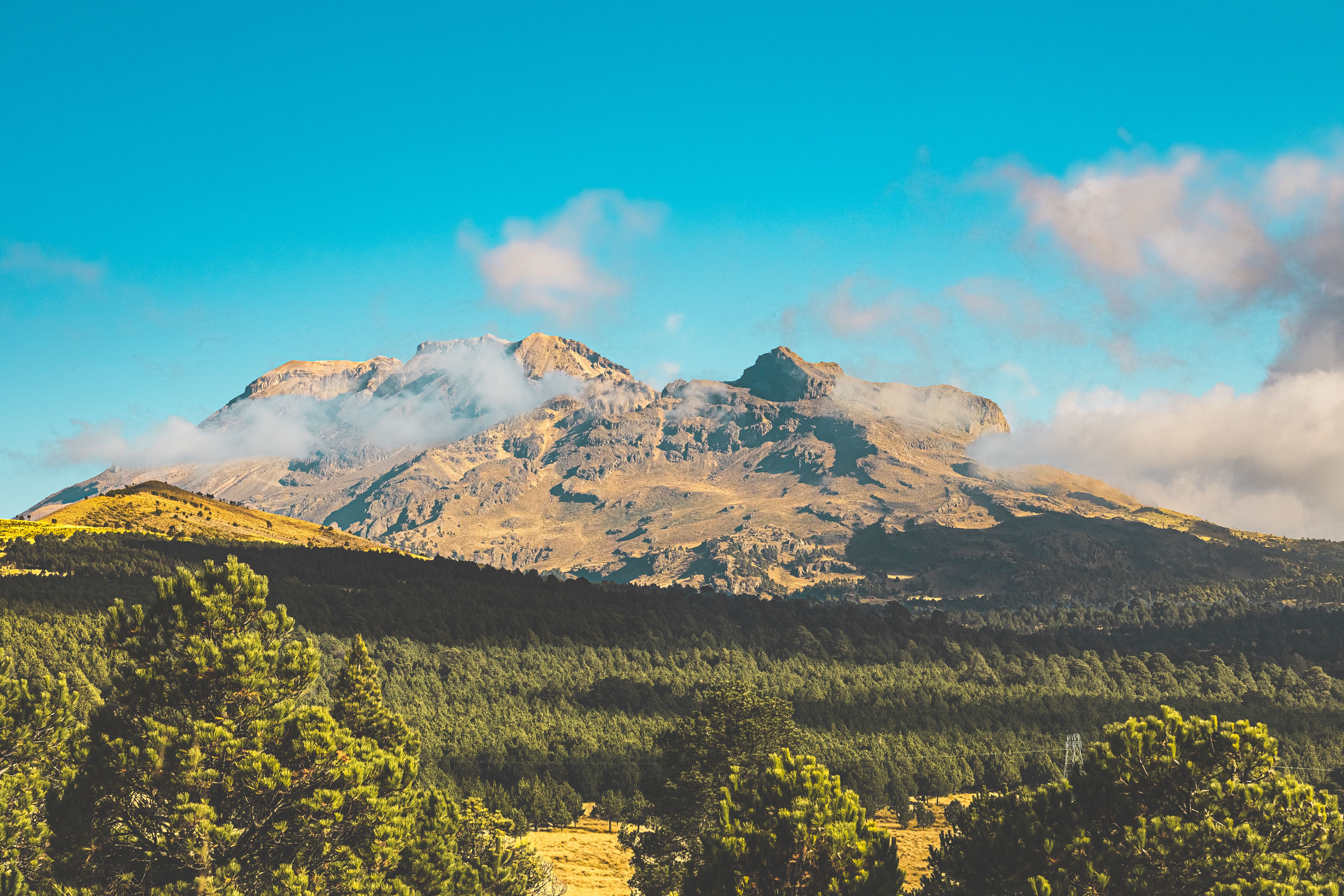 Majestic Mountain Range Under Clear Blue Sky · Free Stock Photo