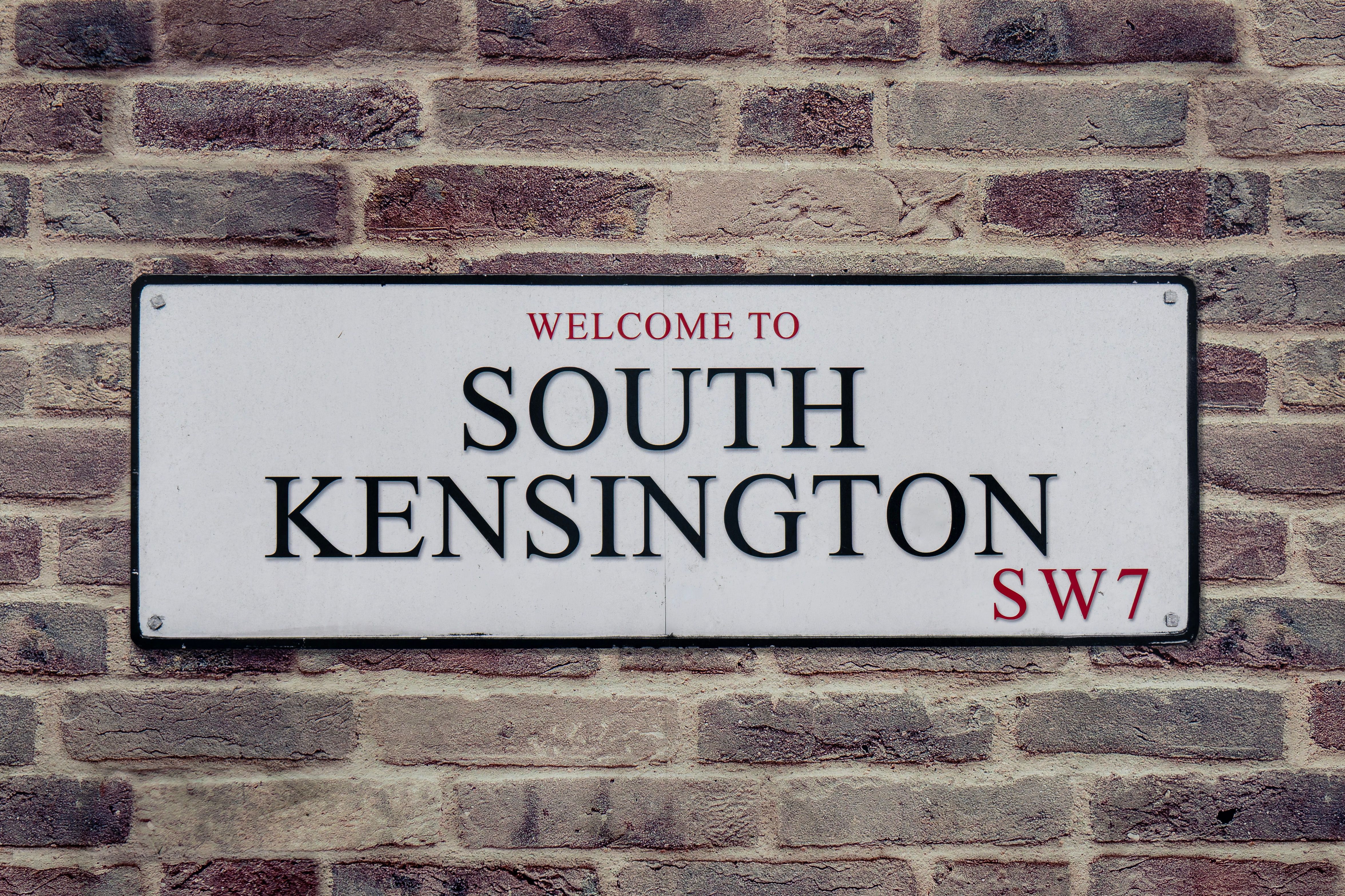 Street sign for South Kensington, London, UK, showcasing local charm.