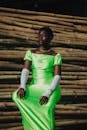 Elegant Woman in Neon Green Dress Outdoors