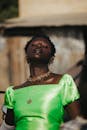 Stylish Woman in Green Dress with Jewelry