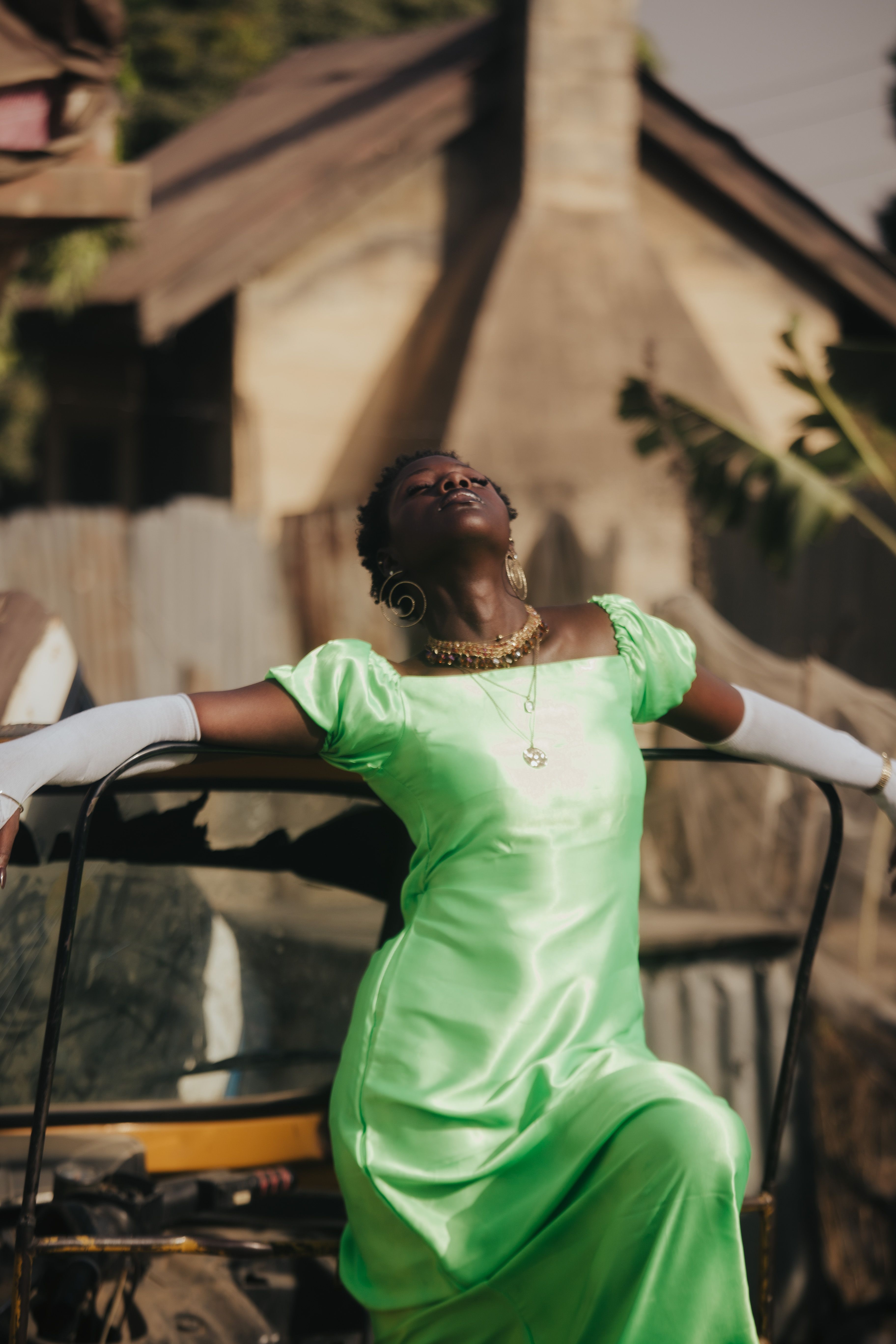 Elegant Woman in Green Dress Outdoors · Free Stock Photo
