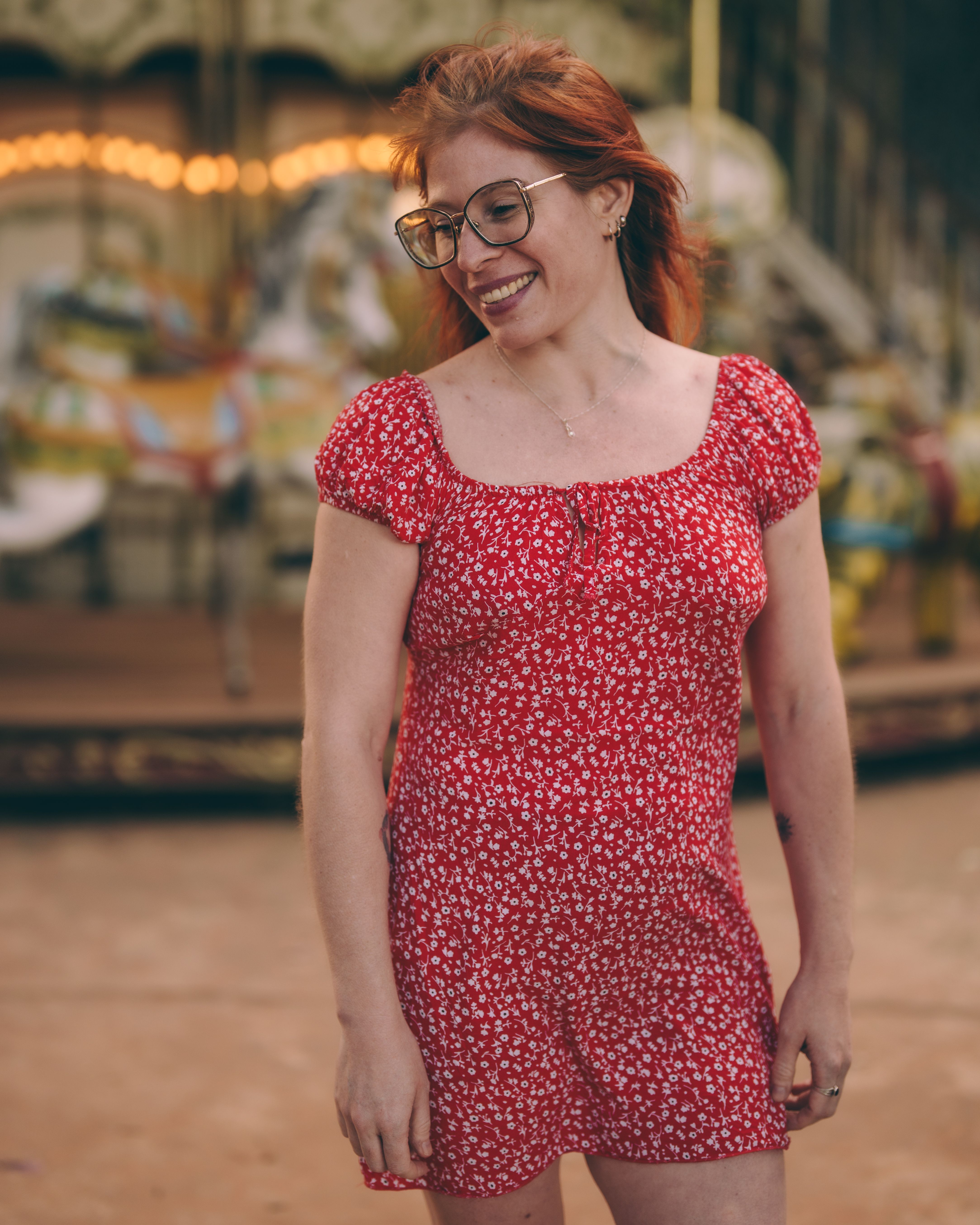 Joyful Woman in Red Dress at Vintage Carousel · Free Stock Photo