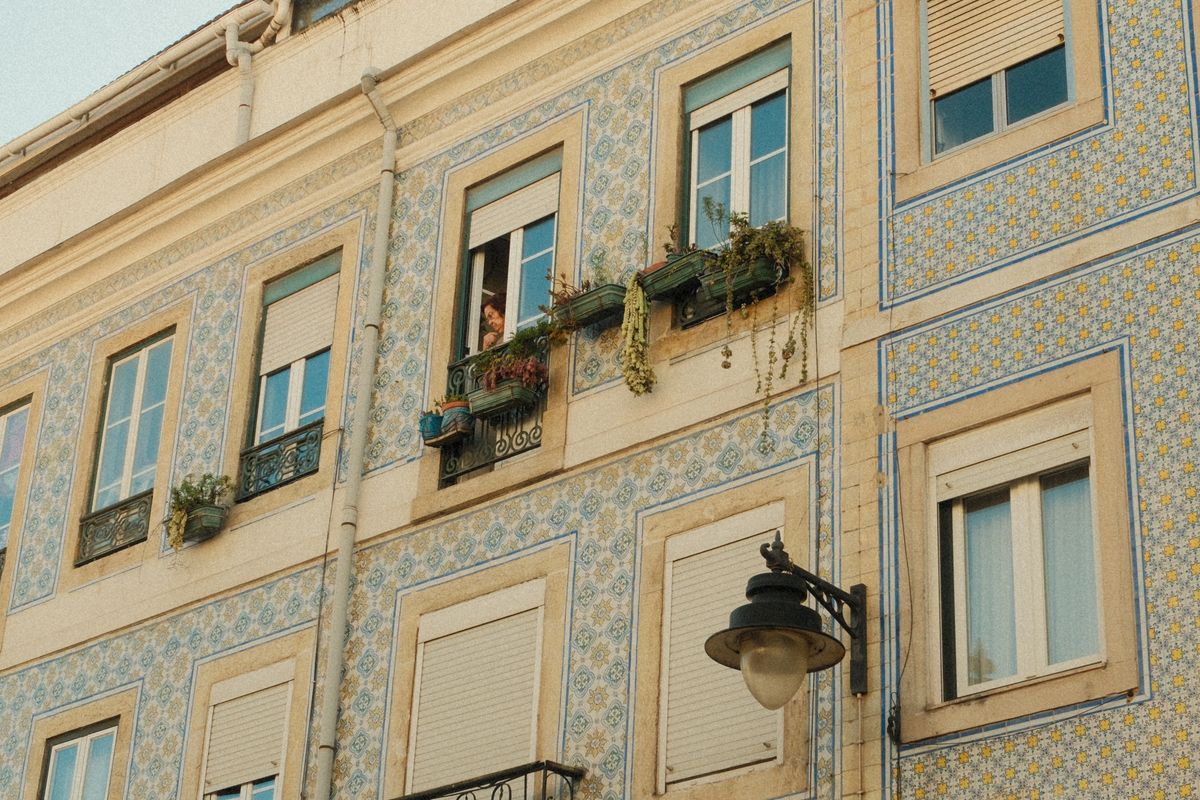 Azulejo-tiled building facades — Lisbon's tilework tradition turns the whole city into an open-air museum.