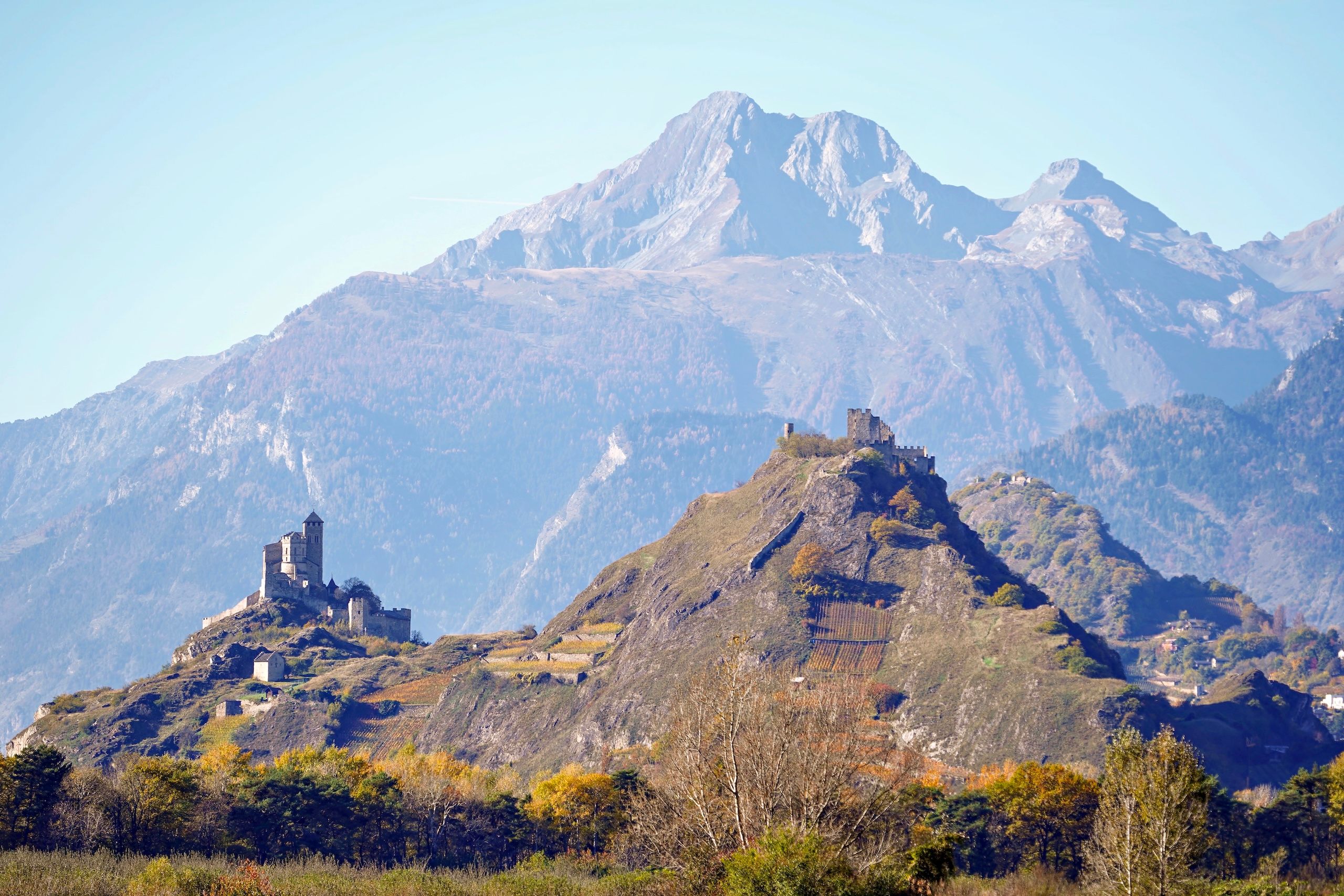 Majestic view of Valère Castle and Tourbillon Castle in Sion, Switzerland under clear skies. - Sion