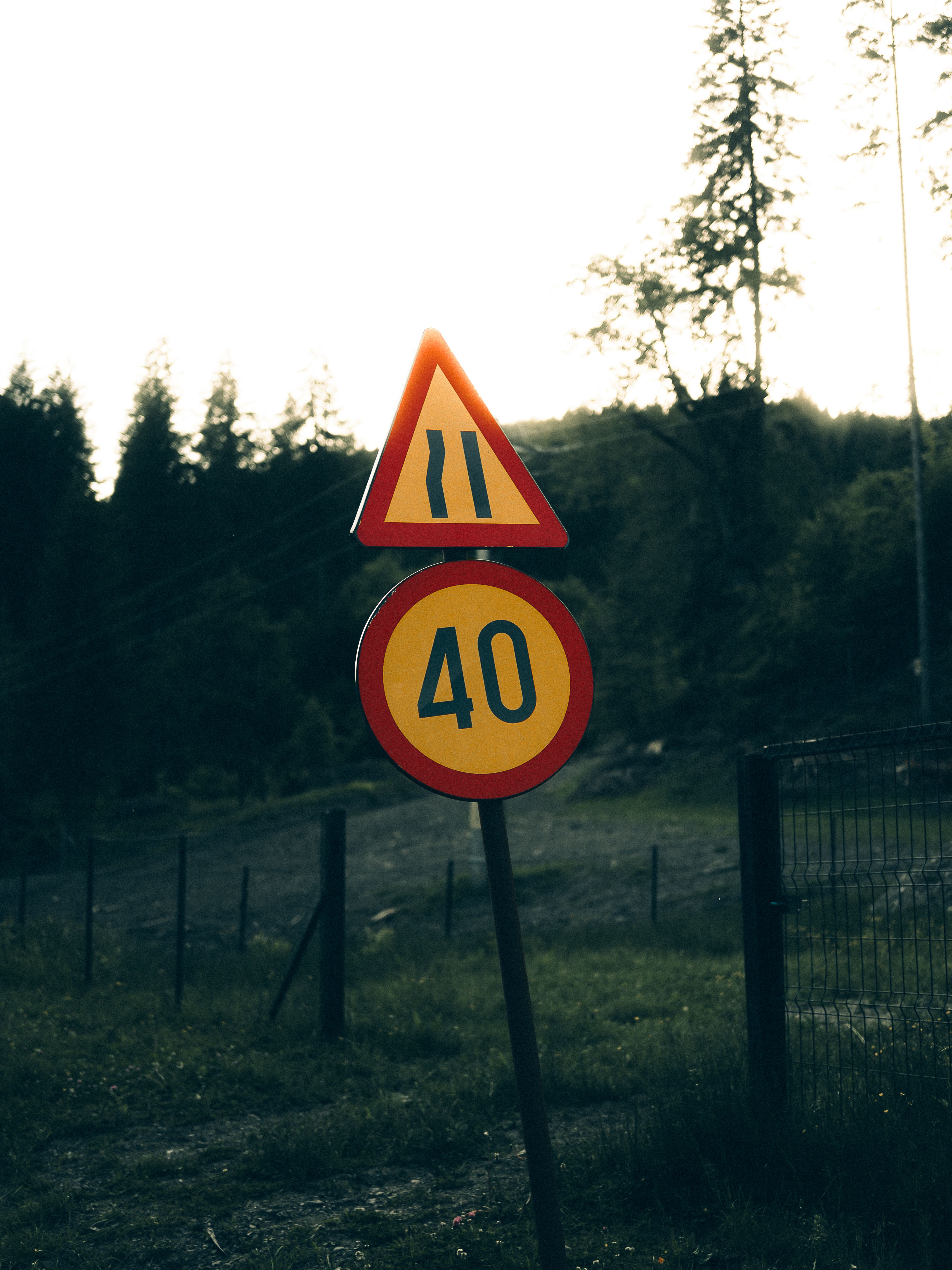 Rural Road Sign with Speed Limit at Dusk · Free Stock Photo