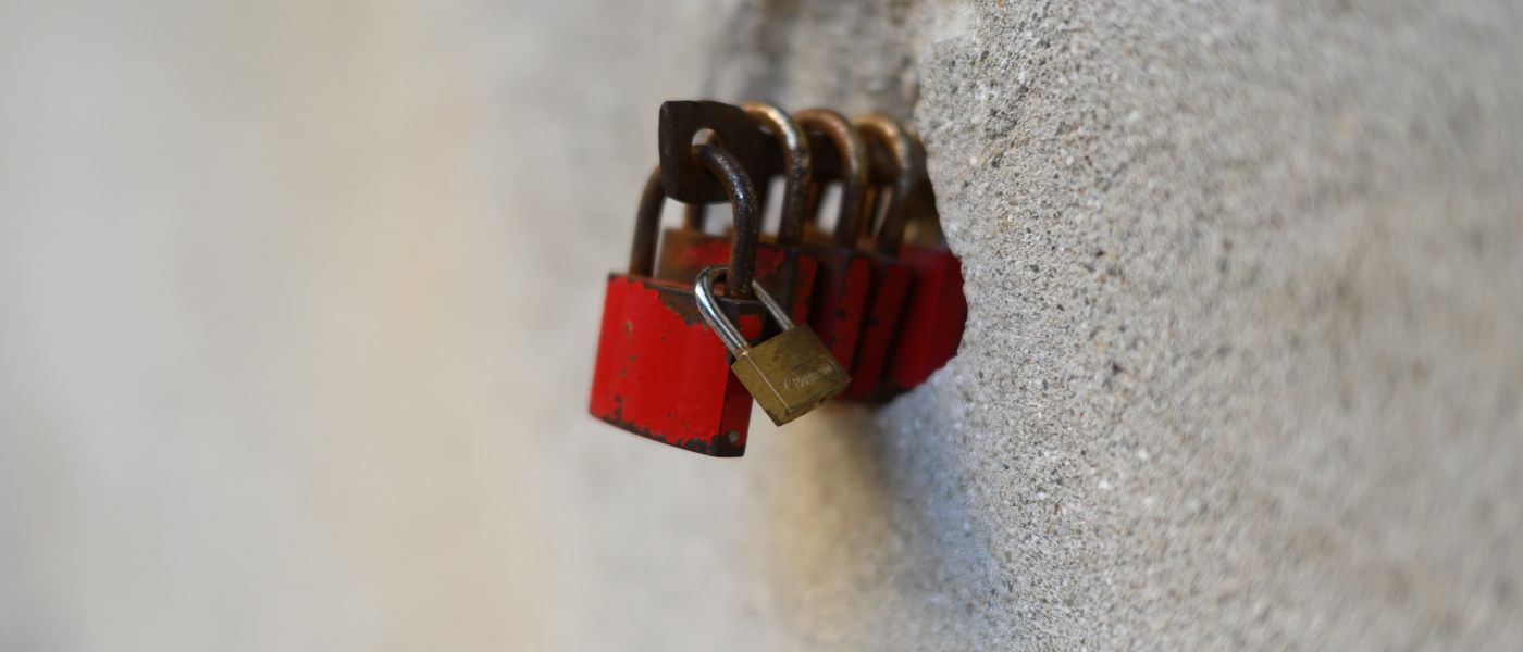 Abstract network diagram illustrating Zero Trust security principles with a digital padlock and interconnected secure nodes, emphasizing 'never trust, always verify'.