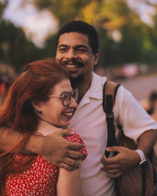 Free Joyful couple embracing outdoors, capturing happy and warm moments. Stock Photo