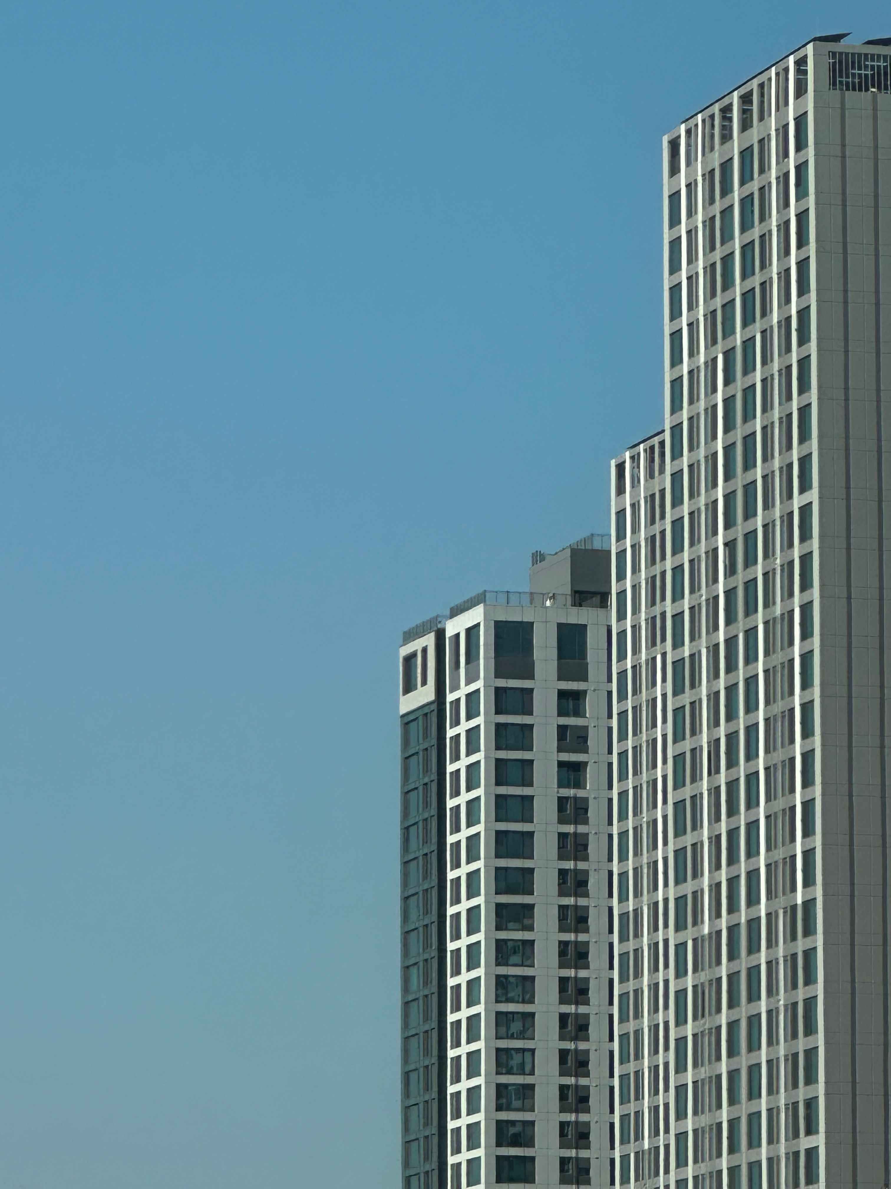modern skyscrapers against a clear blue sky