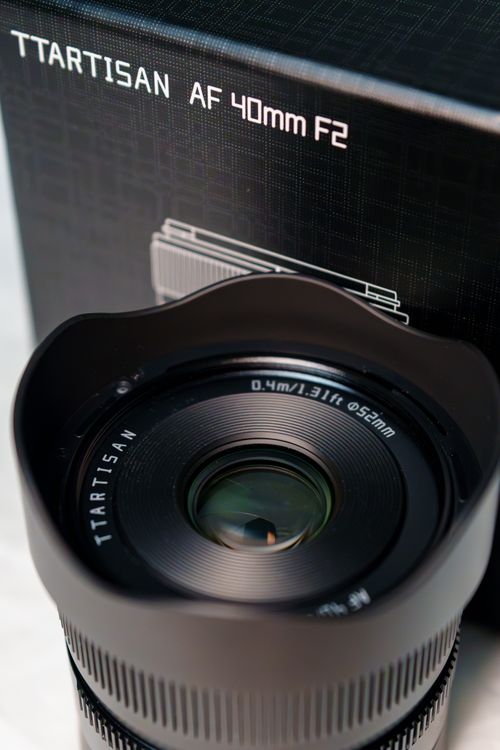 Free Detailed view of TTArtisan's 40mm F2 camera lens showcasing design and specifications. Stock Photo