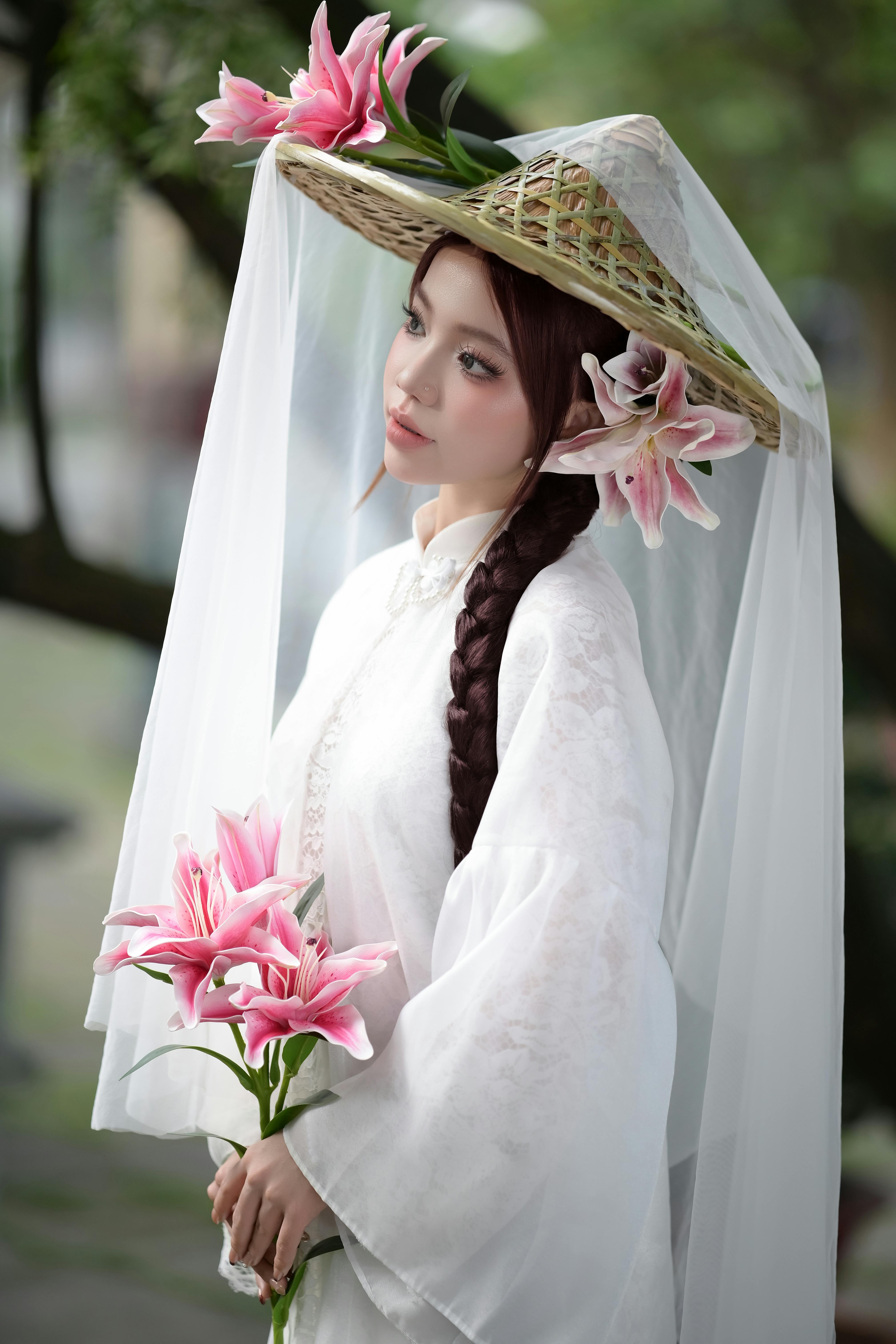 Elegant Woman in Traditional Attire with Lilies