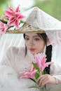 Elegant Woman in Traditional Attire with Lilies