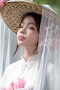 Portrait of Woman in Straw Hat with Lilies