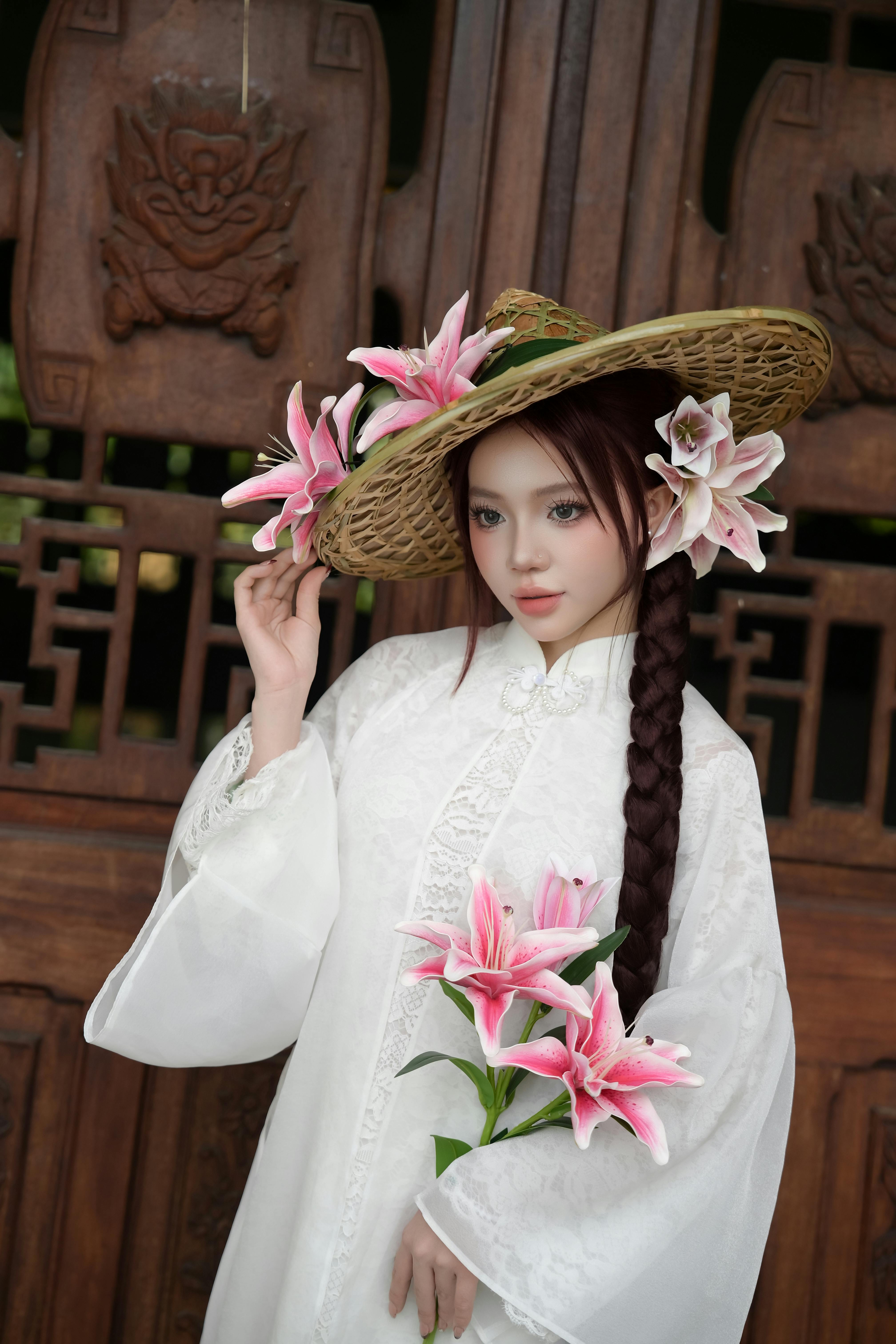 Elegant Woman in Traditional Attire with Lilies