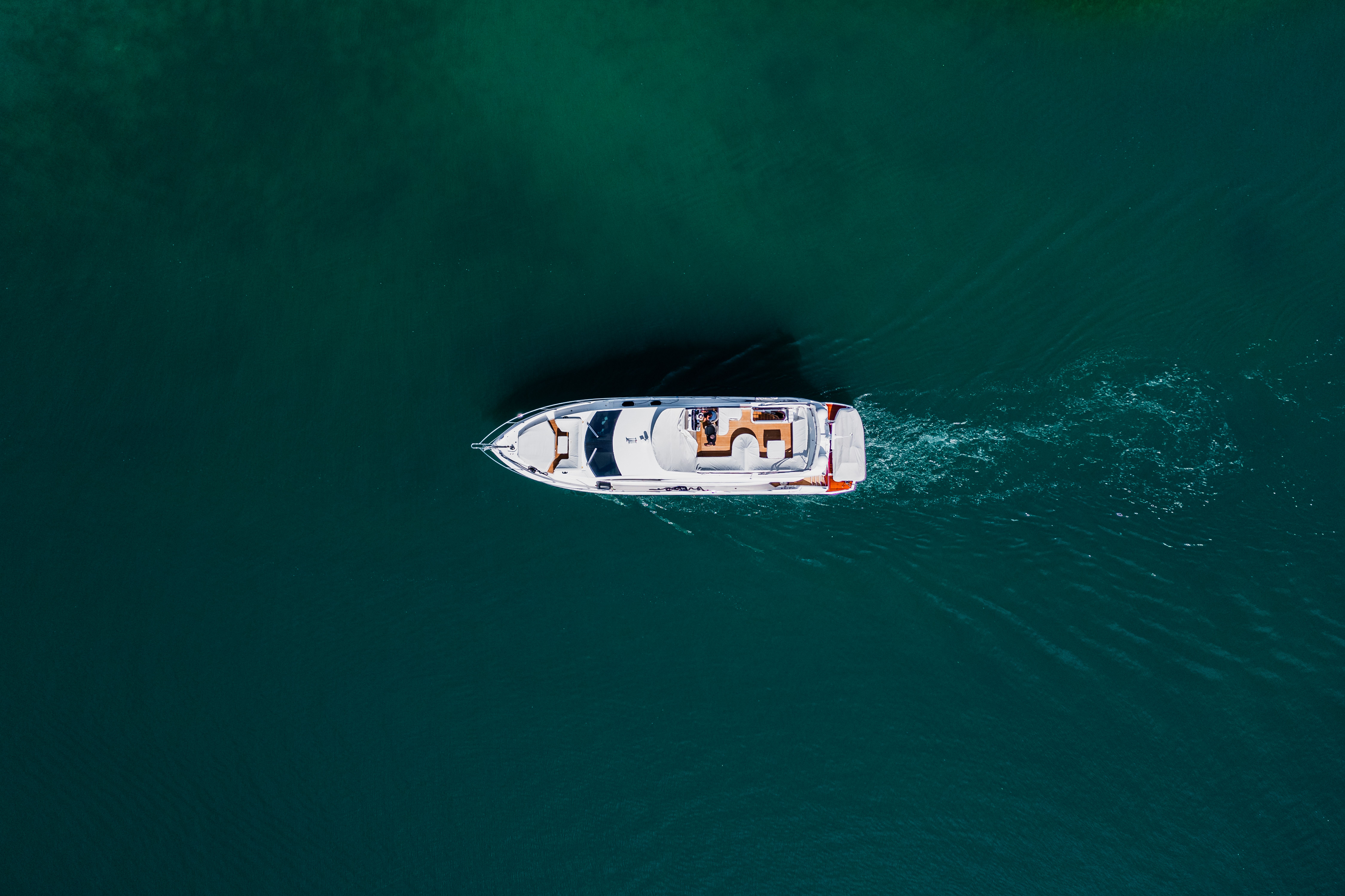 Top View Photo of Boat on Ocean · Free Stock Photo