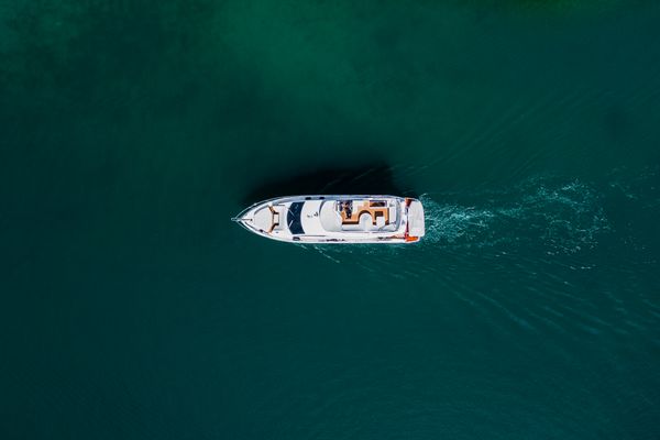 Top View Photo of Boat on Ocean · Free Stock Photo