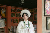 Traditional Asian Attire in Art Gallery Setting