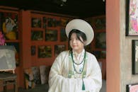 Traditional Asian Attire in Art Gallery