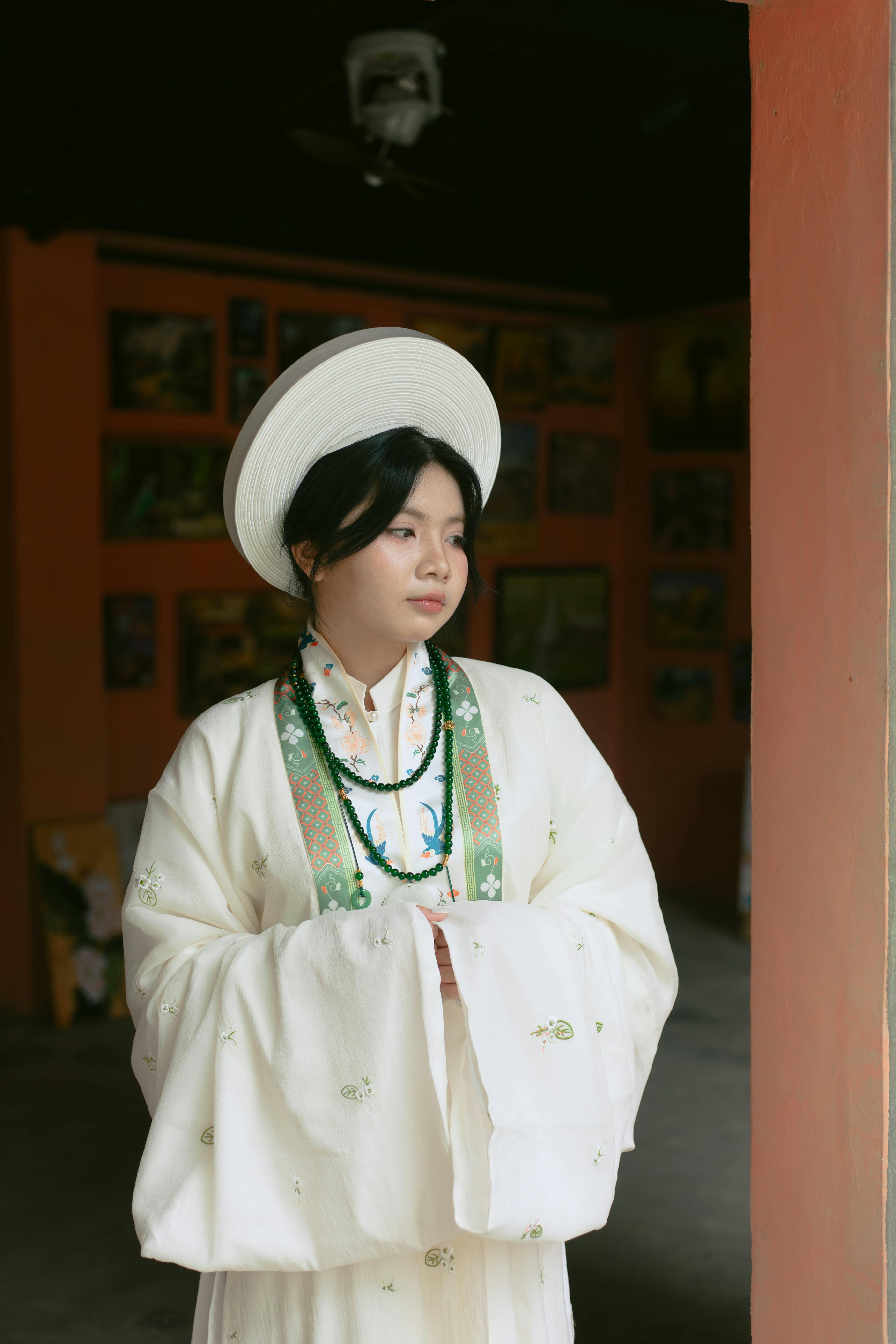 Elegant Woman in Traditional Asian Attire Indoors
