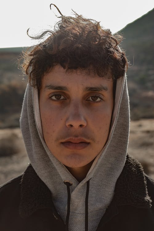 Close-up Photo of Man in Gray Hoodie