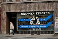 Vintage Record Storefront with Pedestrian