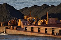 Industrial Cargo Ship with Coal on River