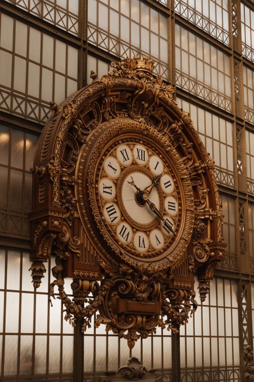 Free Discover the iconic ornate clock at the Musée d'Orsay in Paris, showcasing Beaux-Arts architecture. Stock Photo