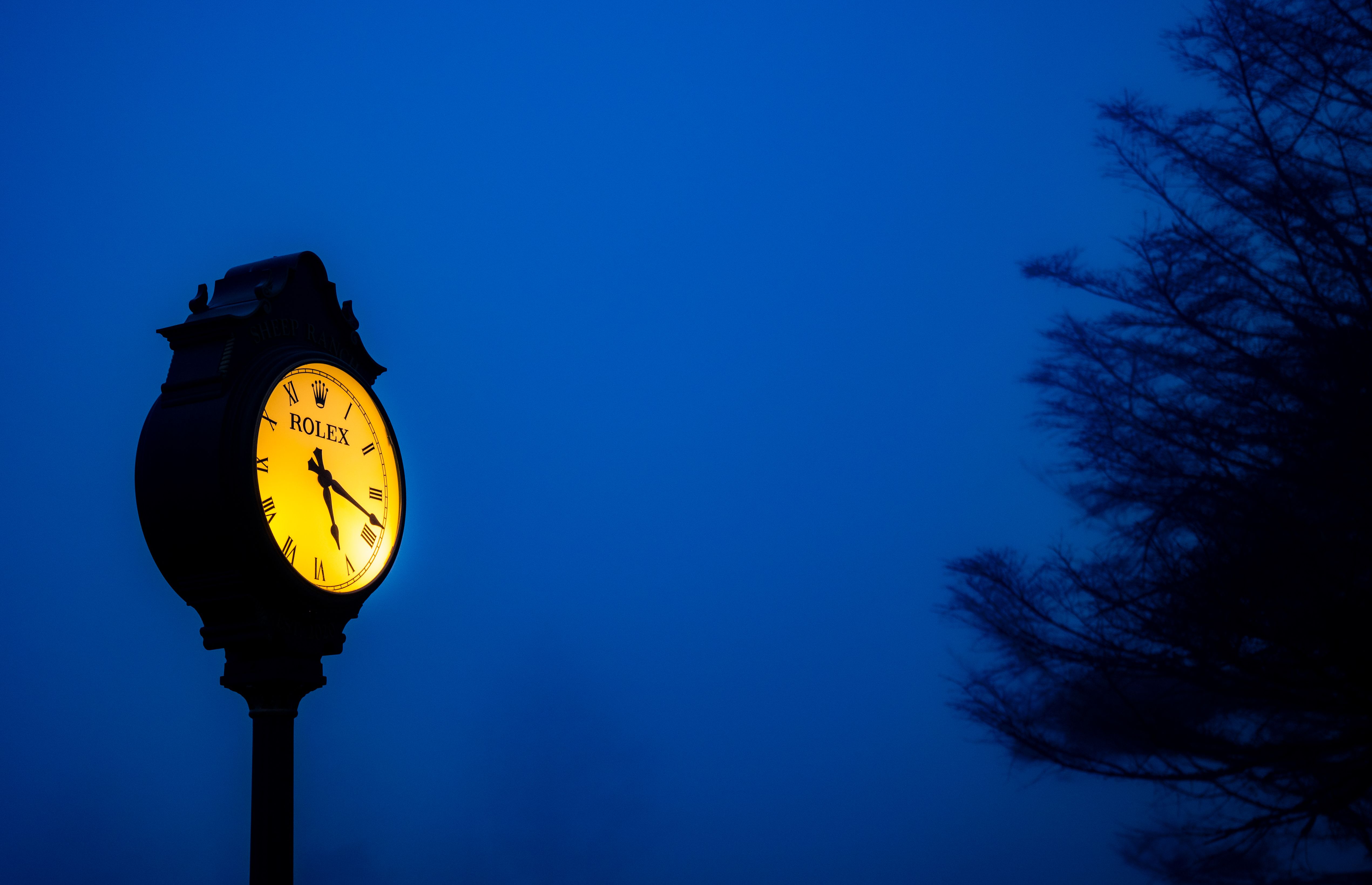 clock showing 6pm with calm evening scene