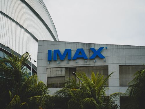 Free Exterior view of IMAX Theatre in Pasay City, Philippines with palm trees. Stock Photo