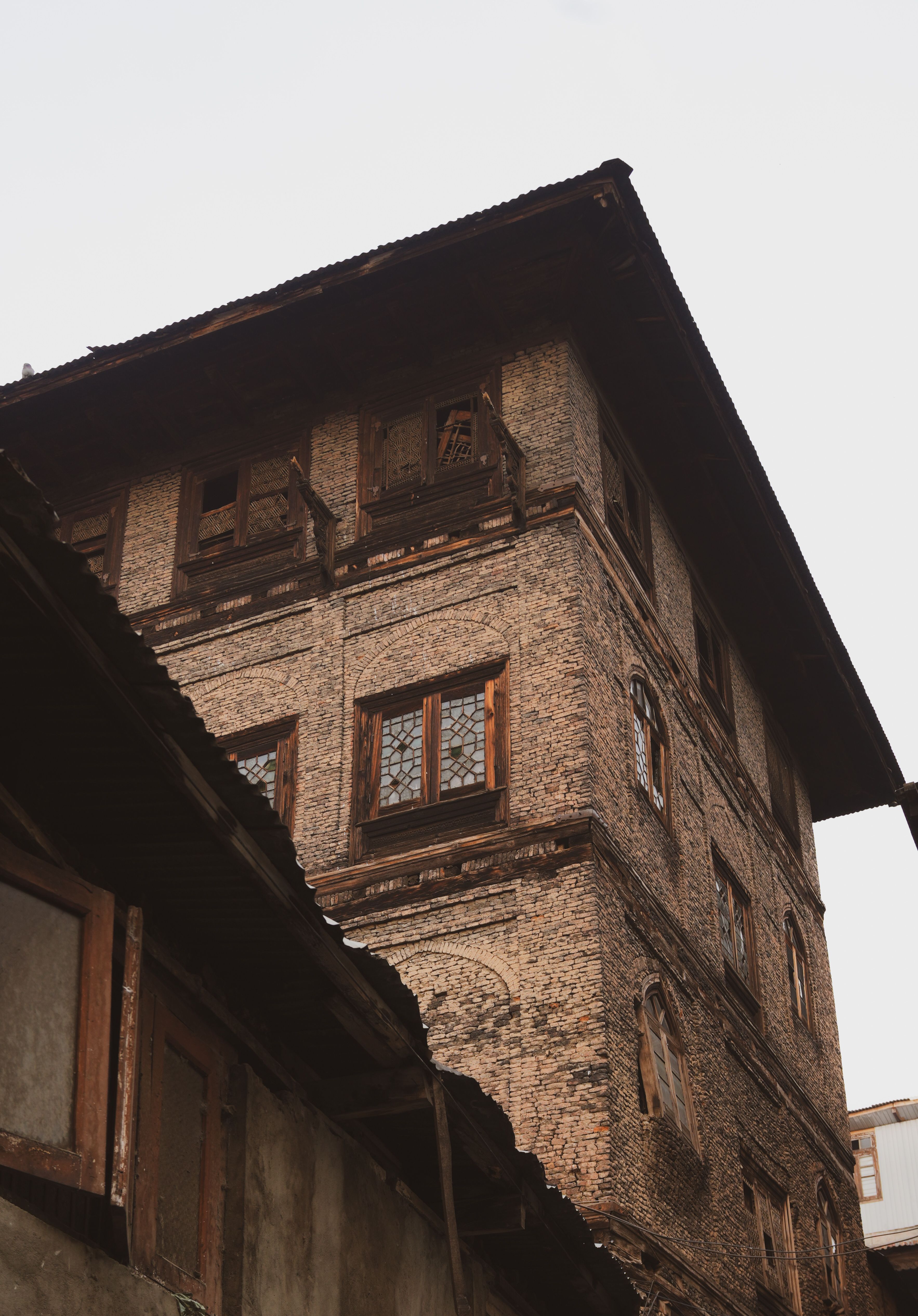 Rustic Old Building with Wooden Details · Free Stock Photo