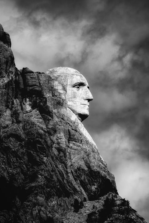 Free Grayscale Photo of Mans Face Concrete Statue Stock Photo