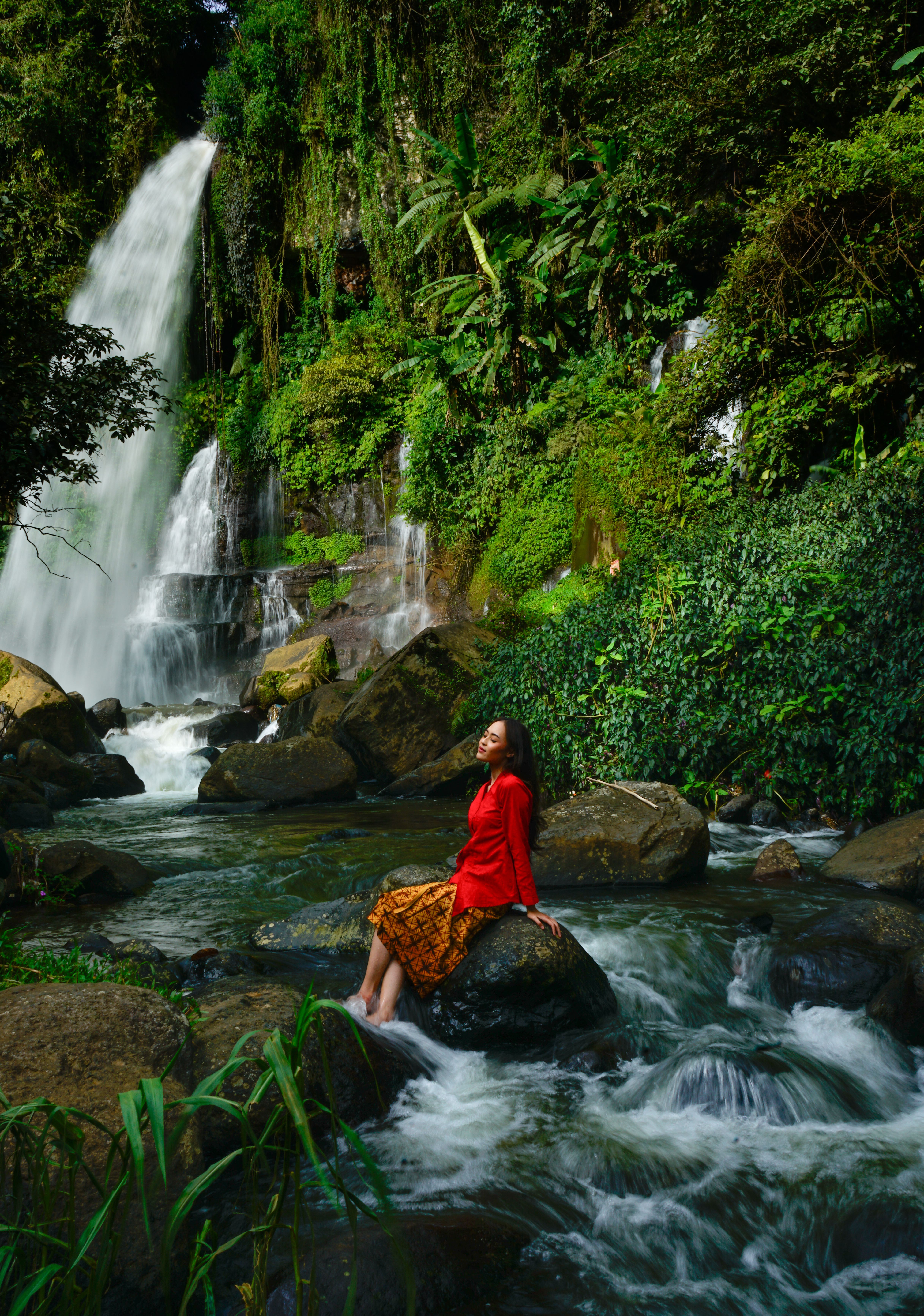 Serene Waterfall Scene in Lush Indonesian Jungle