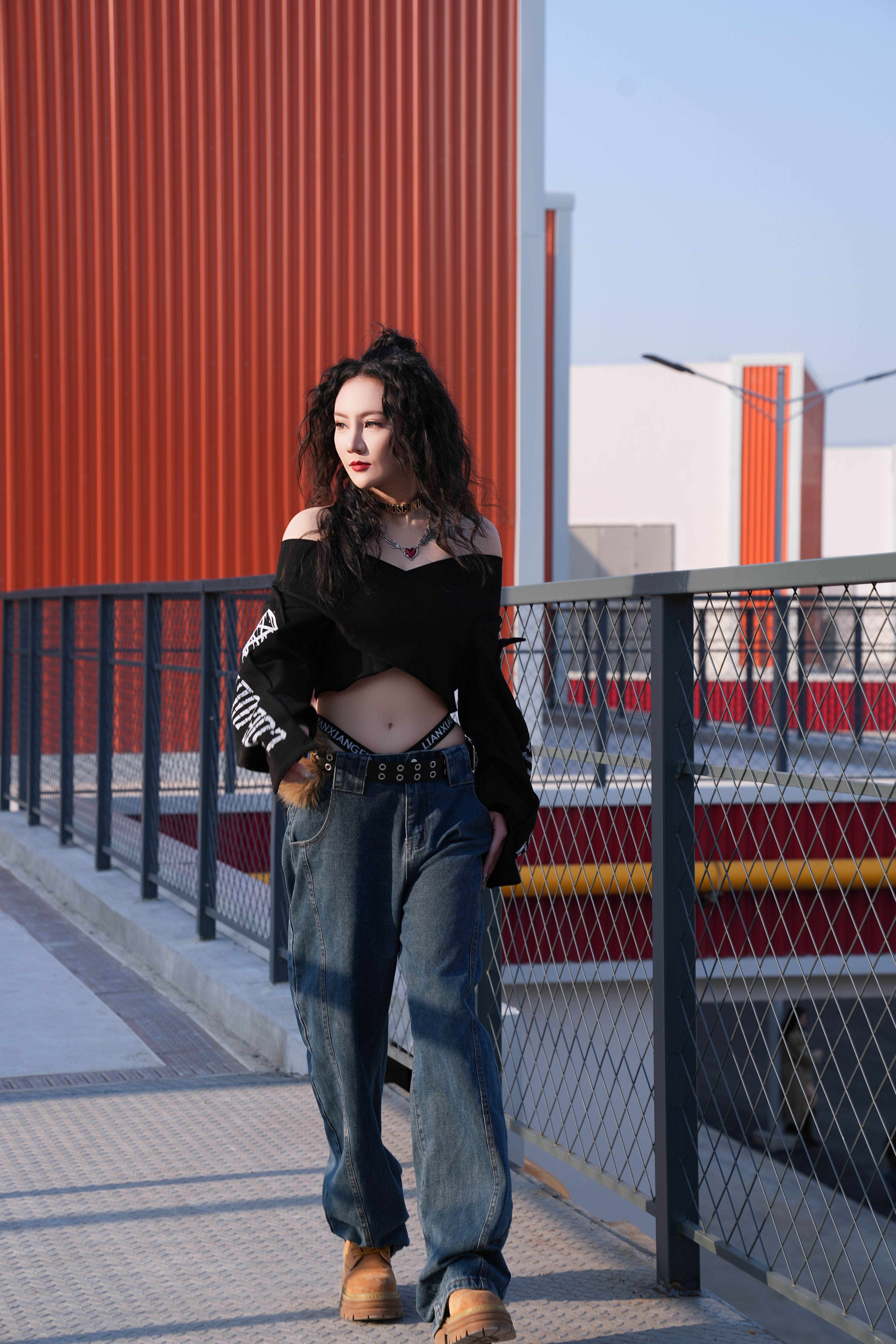 Stylish Young Woman Walking on Urban Pathway · Free Stock Photo
