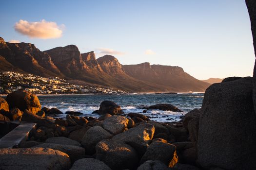 Beautiful view of the Twelve Apostles mountain range and Atlantic Ocean at sunset in Cape Town.
