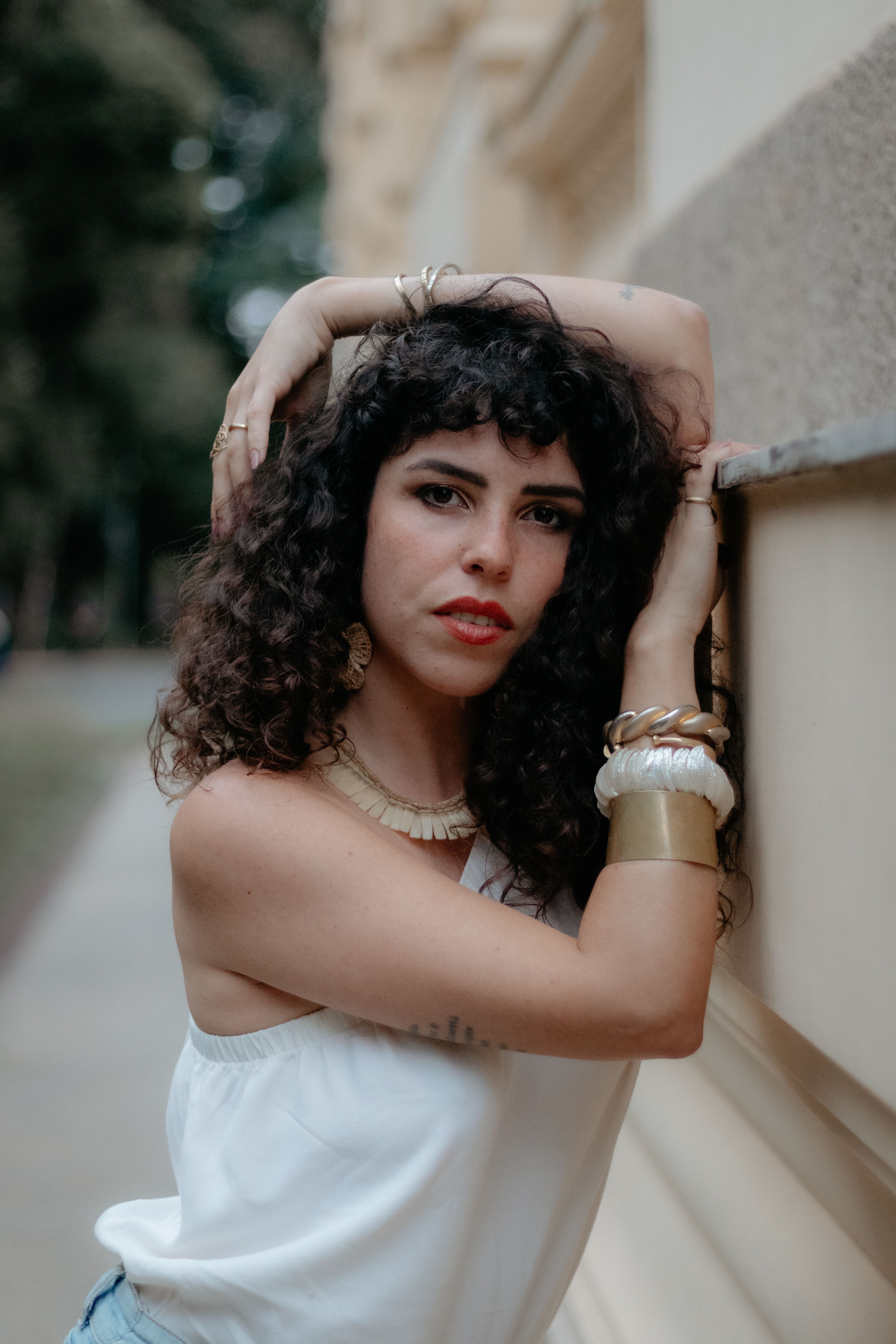 Portrait of a fashionable woman posing outdoors in São Paulo, Brazil with a vintage vibe.