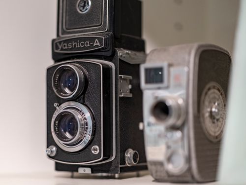 Free Close-up of a vintage Yashica-A twin-lens reflex camera, showcasing its classic retro design, indoors. Stock Photo