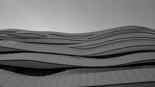 Black and white image of modern architectural facade in Bangkok, Thailand.