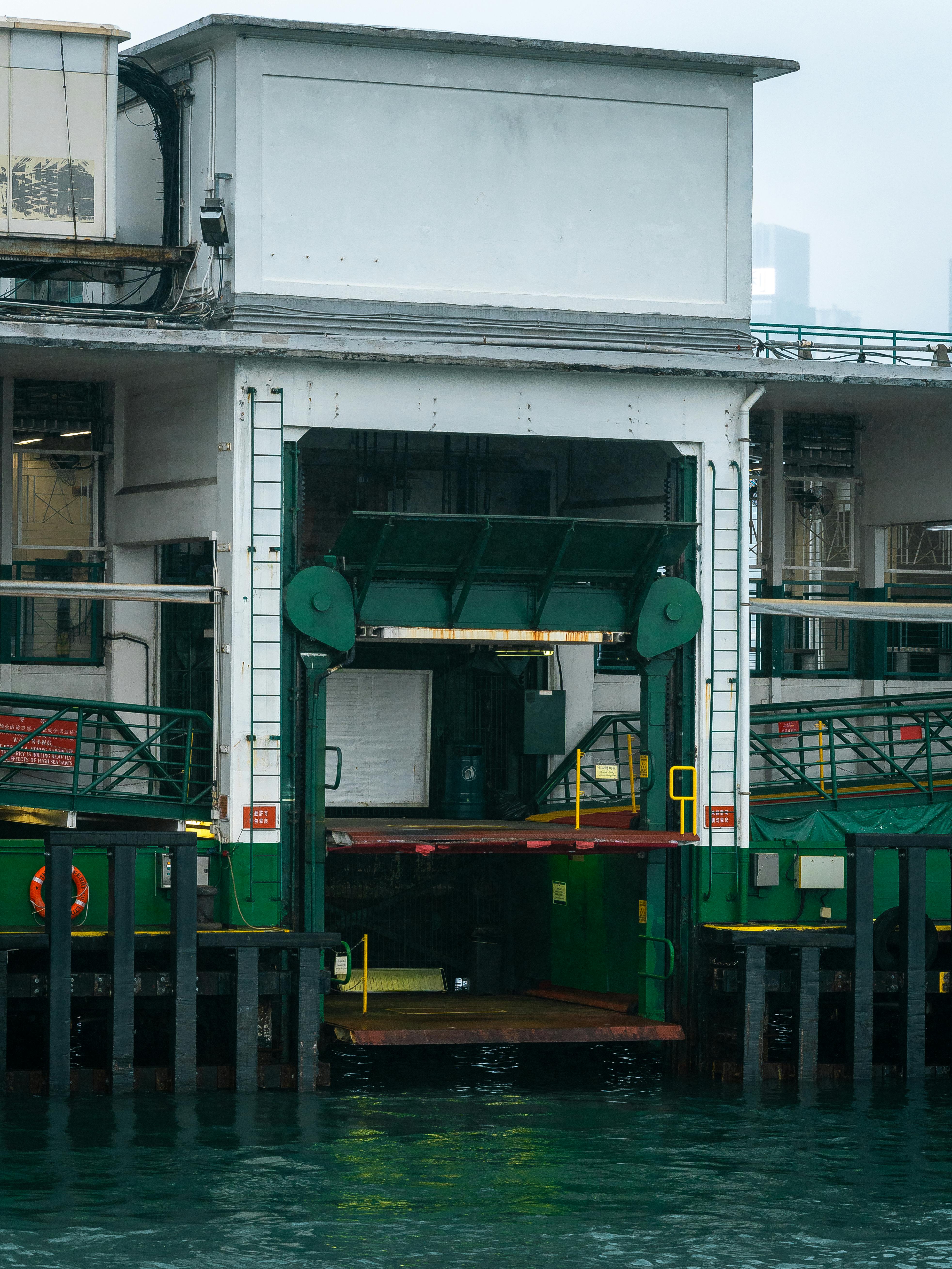 Dock in Urban Harbor with Green and White Details