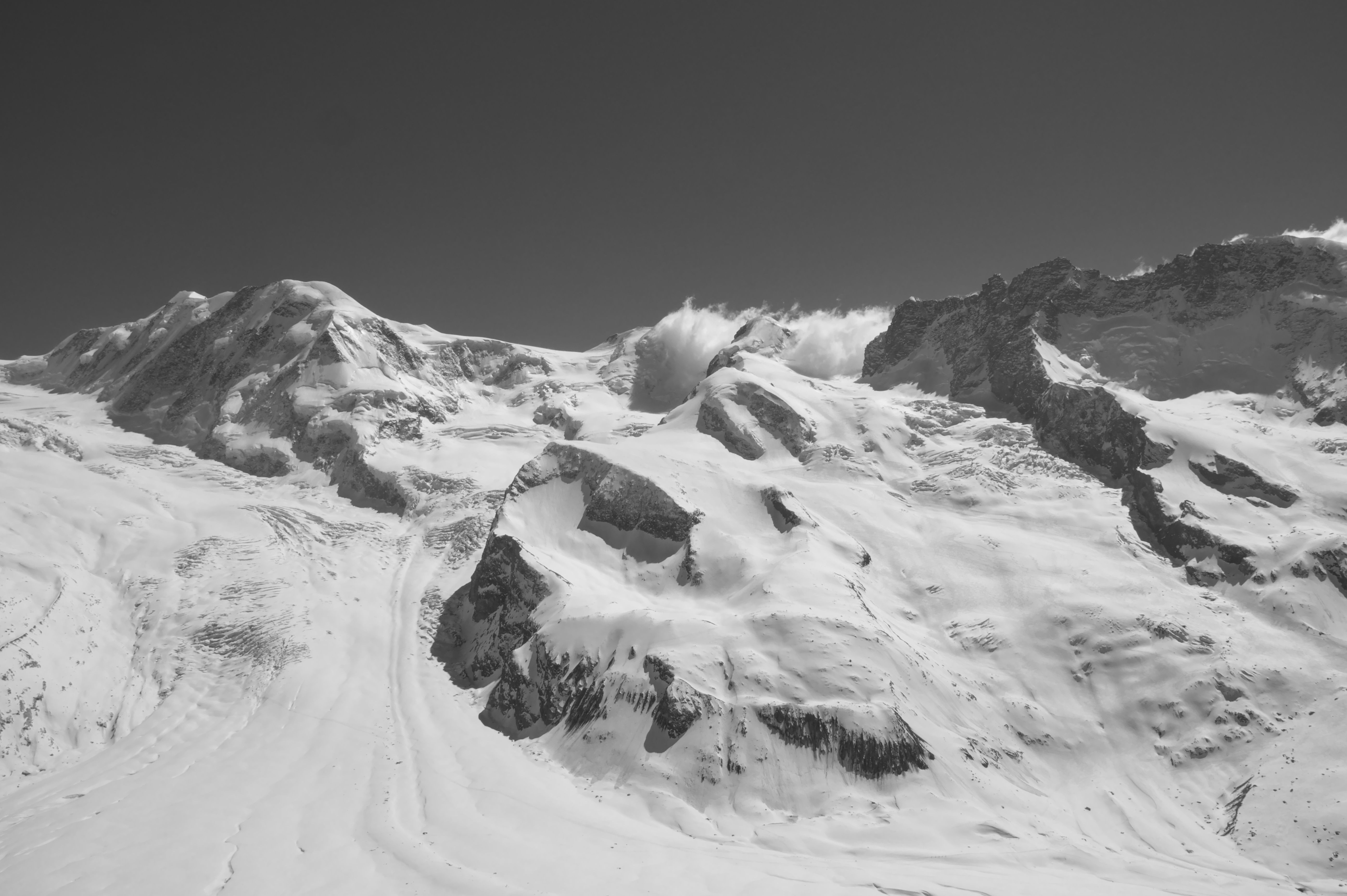 Snow-Capped Peaks of the Swiss Alps in Winter · Free Stock Photo