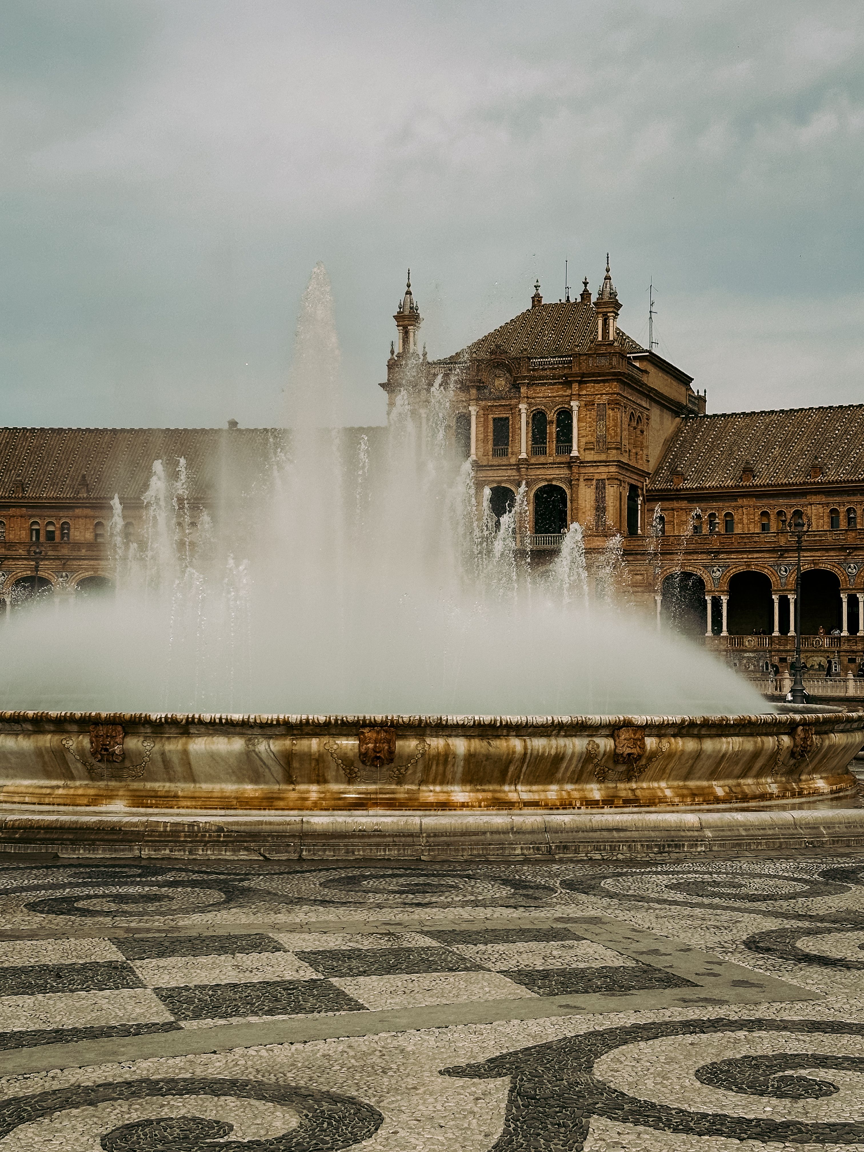 A stunning view of the Plaza de España fountain in Seville, Spain, capturing its architectural grandeur and elegance.