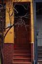 Colorful House Entrance with Bare Tree