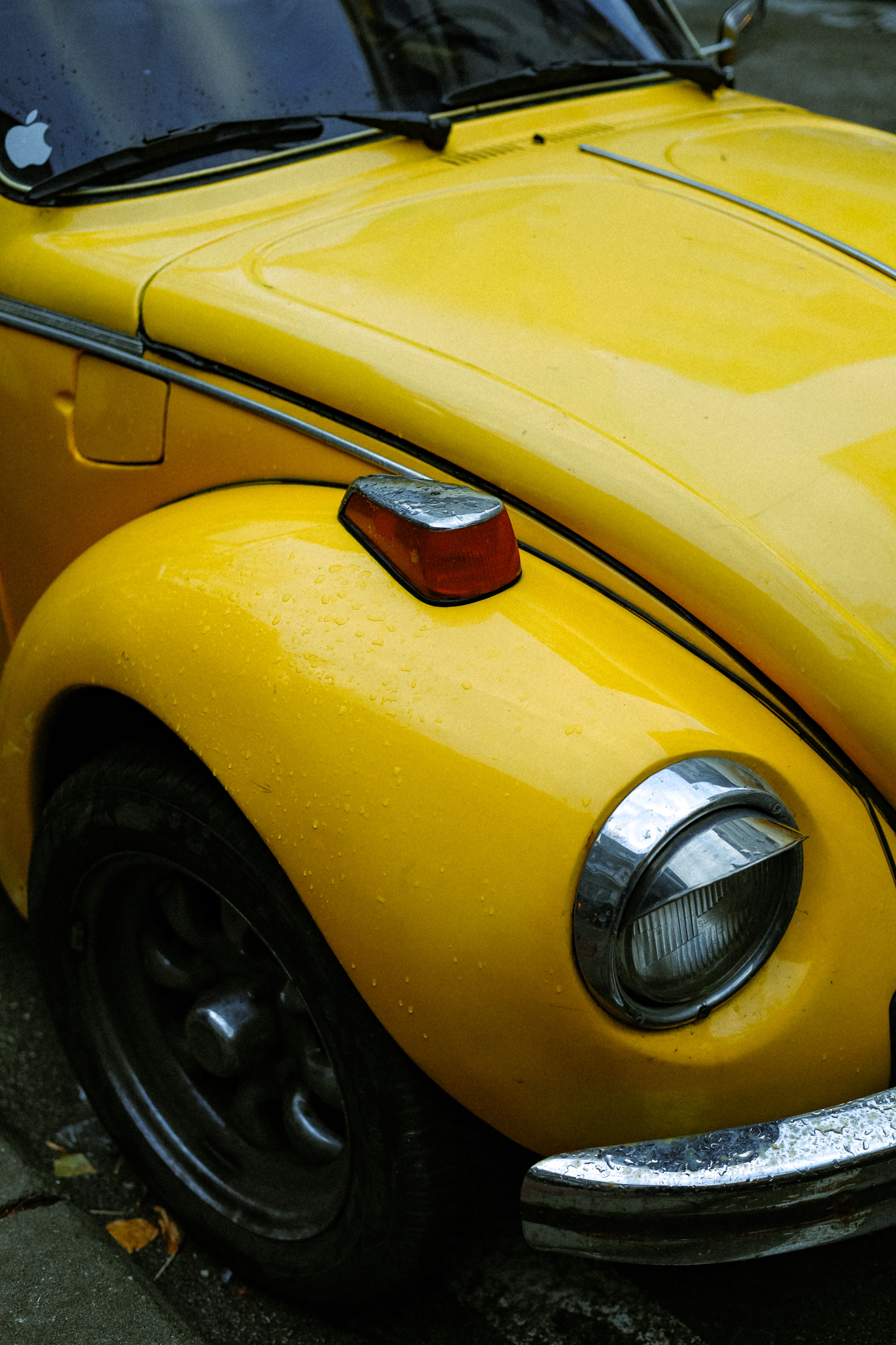 Vintage Yellow Car Close-Up with Raindrops · Free Stock Photo