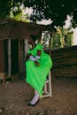 Elegant Woman in Vibrant Green Dress Outdoors