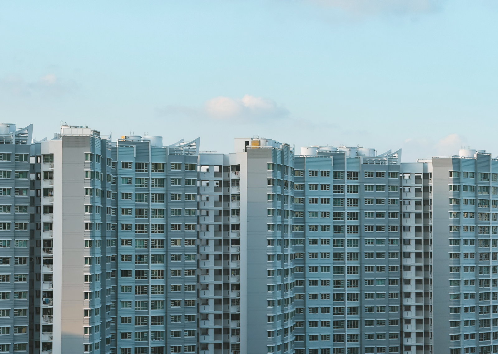 White and Blue Concrete Buildings Under the Blue Sky · Free Stock Photo