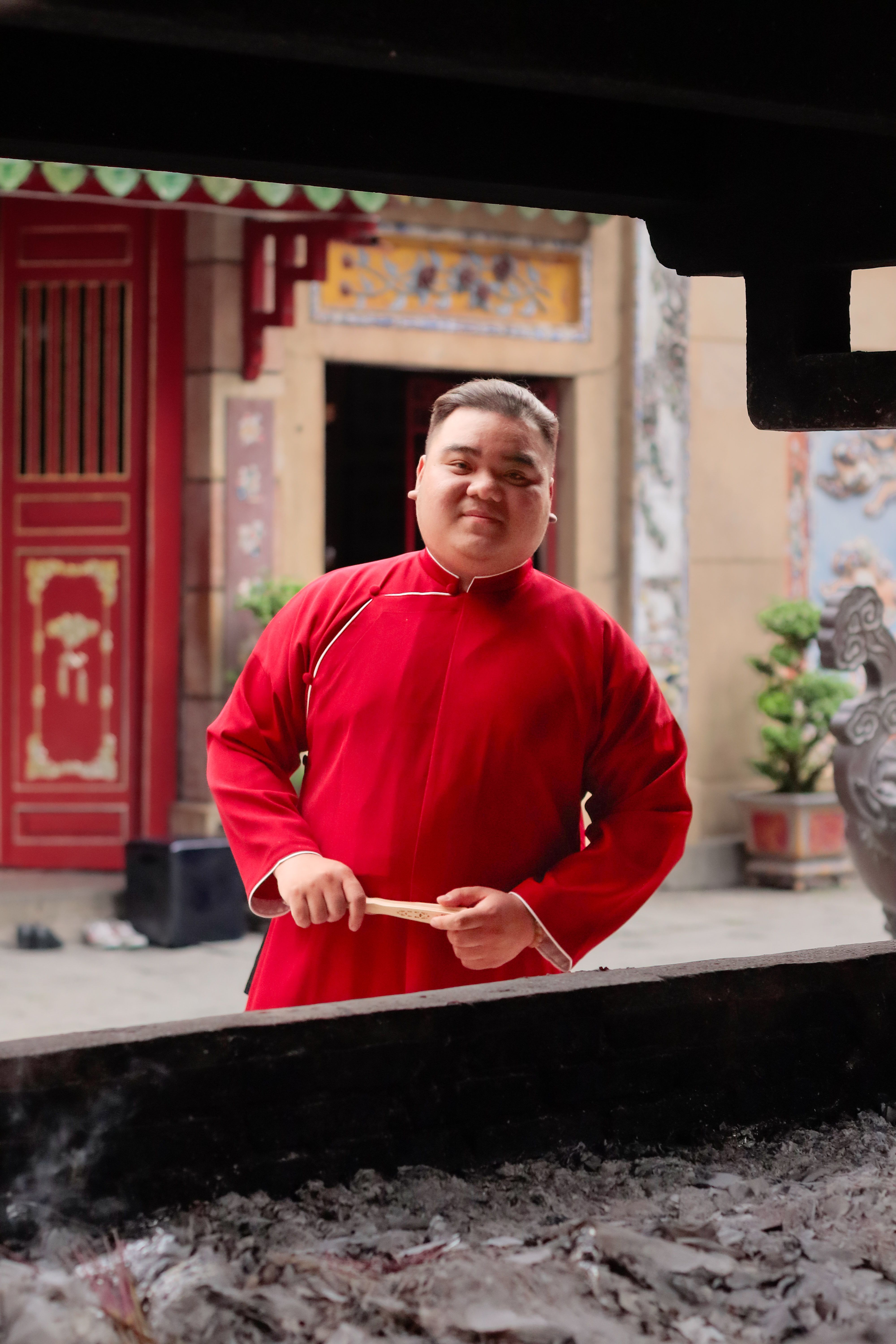 Man in Red Robe at Traditional Temple · Free Stock Photo