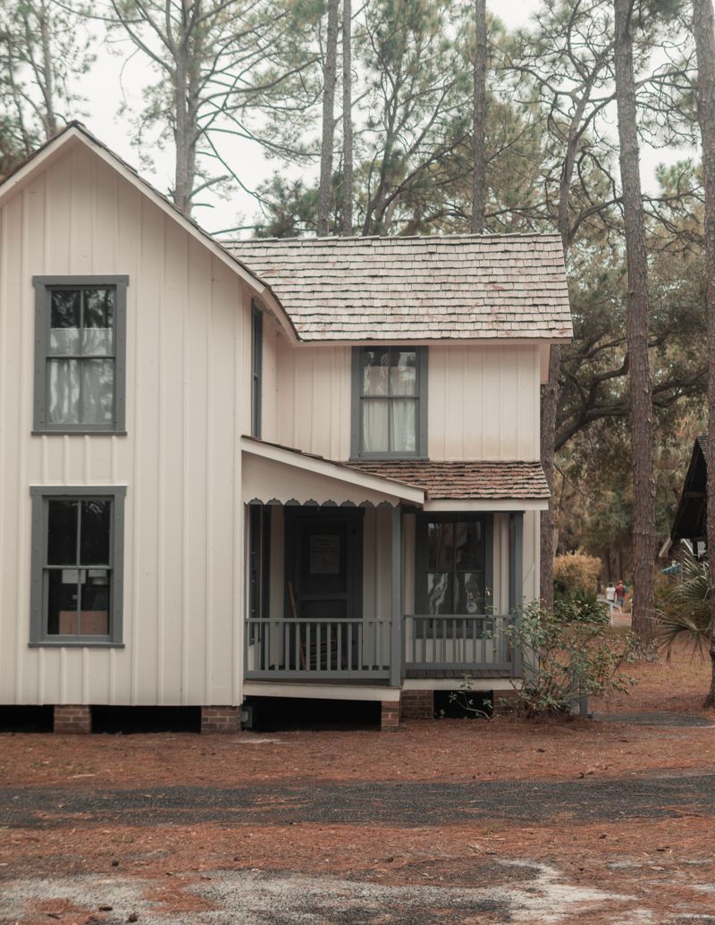 House with vertical siding among trees