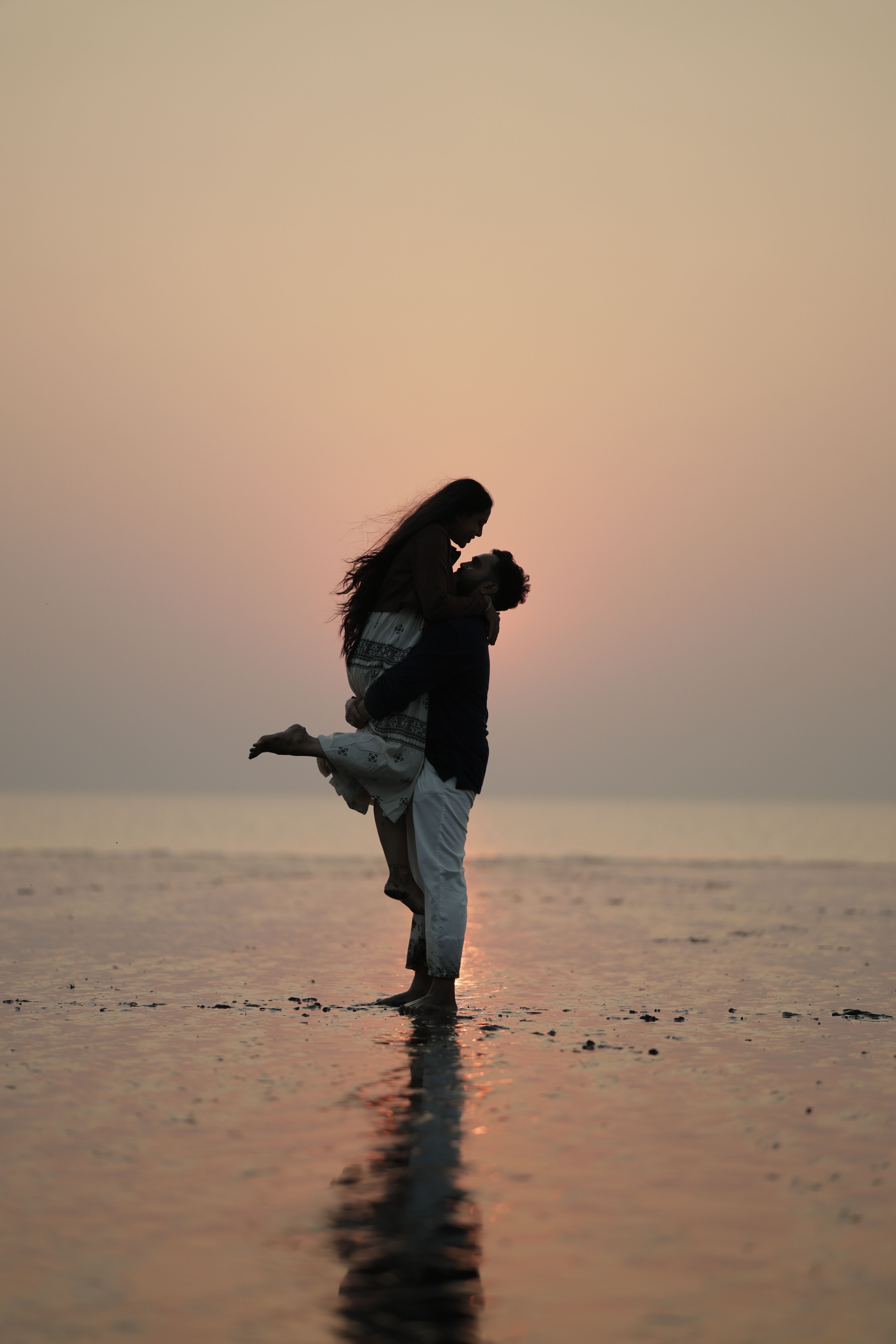 Silhouette of a Romantic Couple on the Beach during Sunset · Free Stock ...
