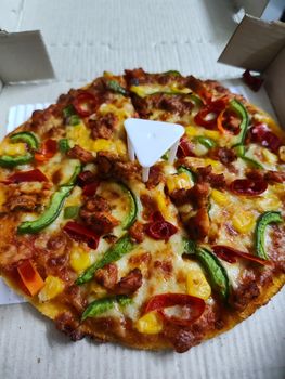 Thick Crust Pizza With Meat And Vegetables