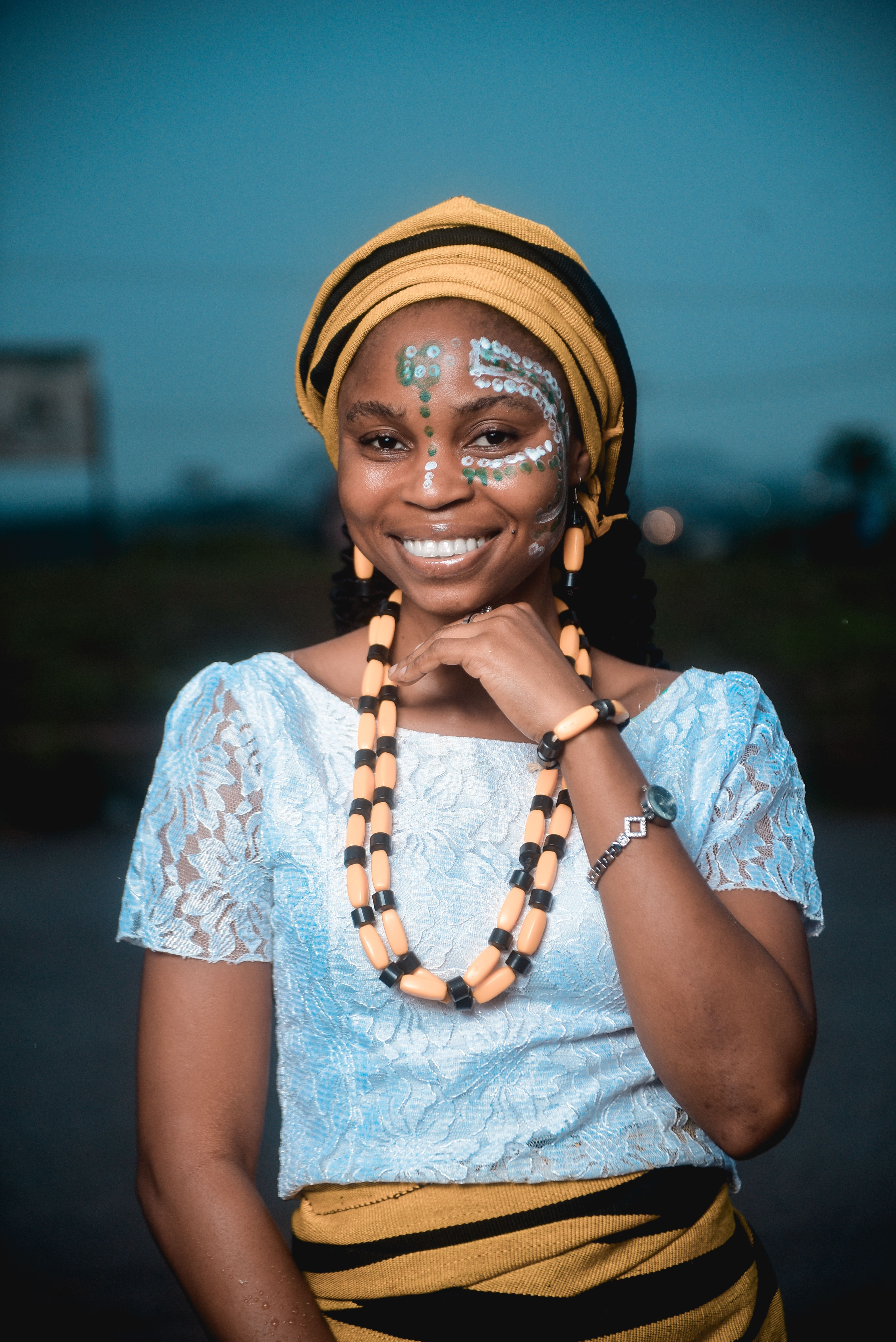 Smiling Woman in Traditional African Attire · Free Stock Photo