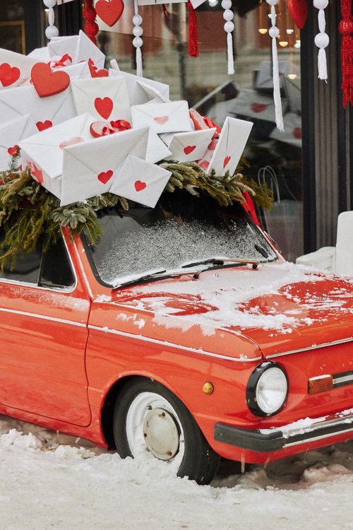 Festive Vintage Car Loaded with Love Letters · Free Stock Photo